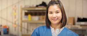 Smiling woman in scrubs